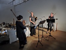Blondel playing among the exhibits in a gallery